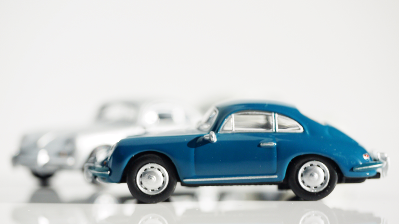Illustration for article titled Kyosho Porsche 1 1/64 #84 - Projekt RennSport Käfer #2 - 1965 Porsche 356 C Coupe